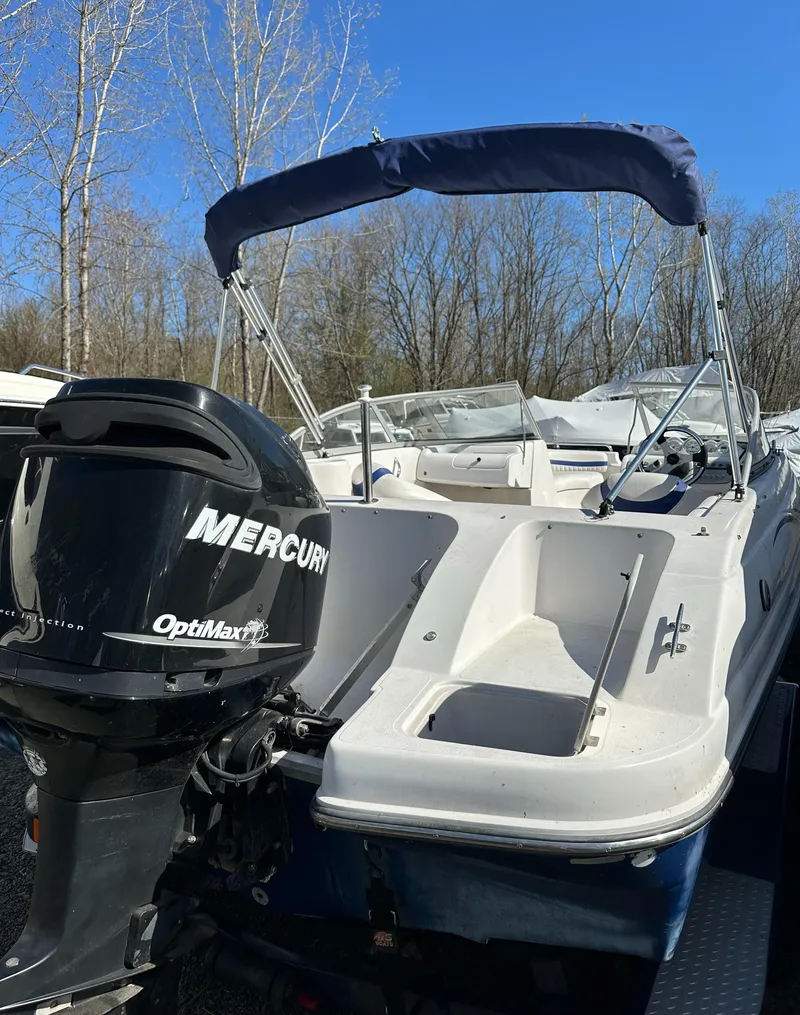 Slide: The Image of 2007 Smoker Craft Vectra 2042 OB boat with Mercury outboard motor, parked outdoors. - 25