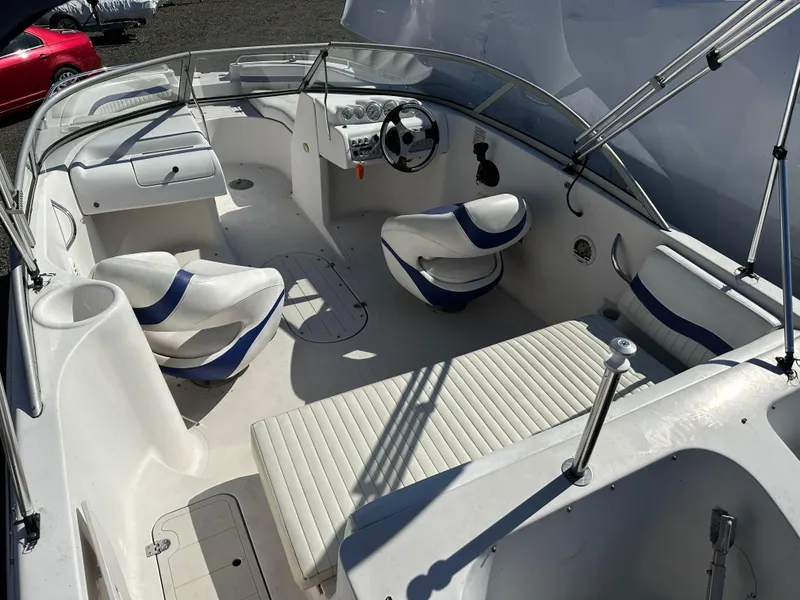 Slide: The Image of 2007 Smoker Craft Vectra 2042 OB boat interior with white and blue seating. - 6