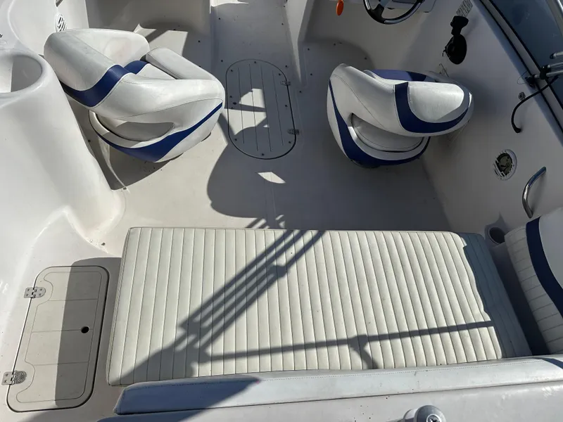 Slide: The Image of 2007 Smoker Craft Vectra 2042 OB boat interior with white and blue seating. - 7