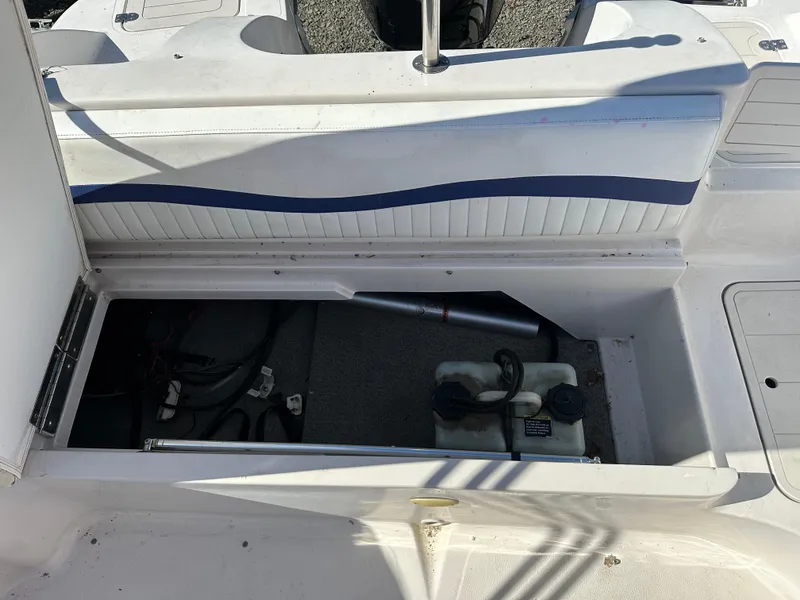 Slide: The Image of 2007 Smoker Craft Vectra 2042 OB boat storage compartment with equipment and accessories. - 9