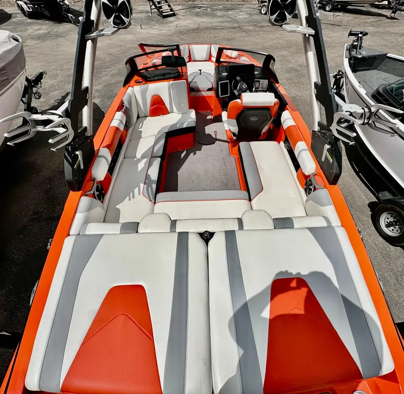 Slide: The Image of 2020 Malibu 21VLX boat interior with orange and white seating, featuring modern design elements. - 5
