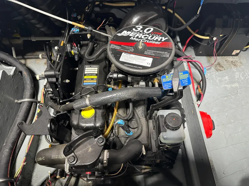 Slide: The Image of 2008 Bayliner 185 engine compartment featuring a 3.0L Mercury MerCruiser engine. - 20
