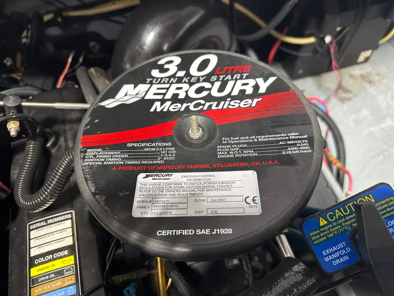 Slide: The Image of 2008 Bayliner 185 engine, featuring a 3.0L Mercury MerCruiser with specifications and caution labels. - 21