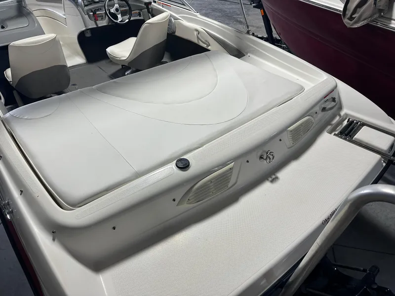 Slide: The Image of 2008 Bayliner 185 boat interior with seating and steering wheel, showcasing sleek design. - 7