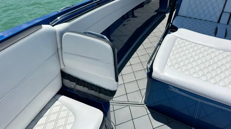 Slide: The Image of 2020 Nor-Tech 390 Sport boat interior with white quilted seating and sleek design. - 14