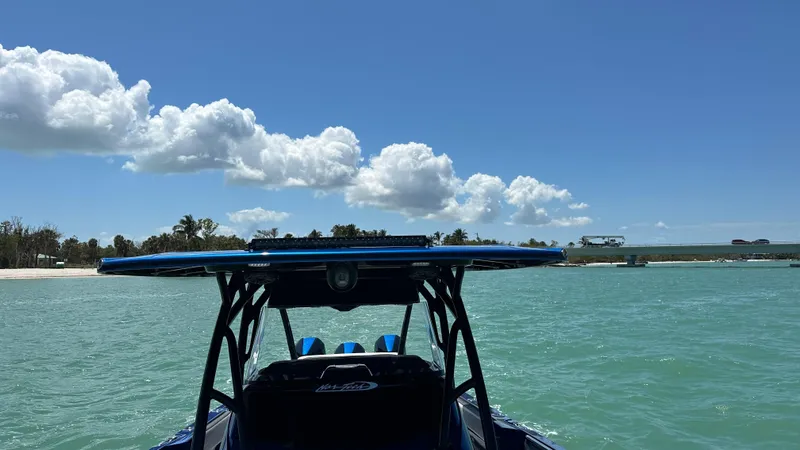 Slide: The Image of 2020 Nor-Tech 390 Sport boat on turquoise water under a clear blue sky. - 18
