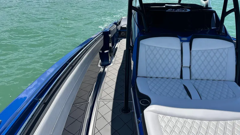 Slide: The Image of 2020 Nor-Tech 390 Sport boat with luxurious seating on calm water. - 20