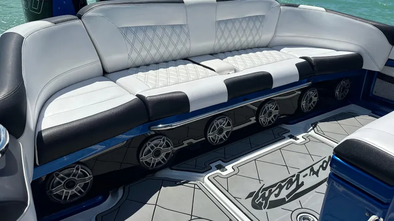 Slide: The Image of Luxurious seating on 2020 Nor-Tech 390 Sport boat with stylish design and premium speakers. - 26
