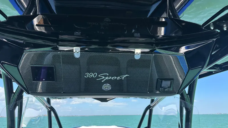 Slide: The Image of 2020 Nor-Tech 390 Sport boat console with ocean backdrop. - 31