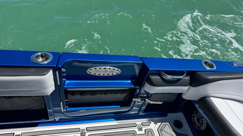 Slide: The Image of 2020 Nor-Tech 390 Sport boat interior with blue accents and ocean view. - 33