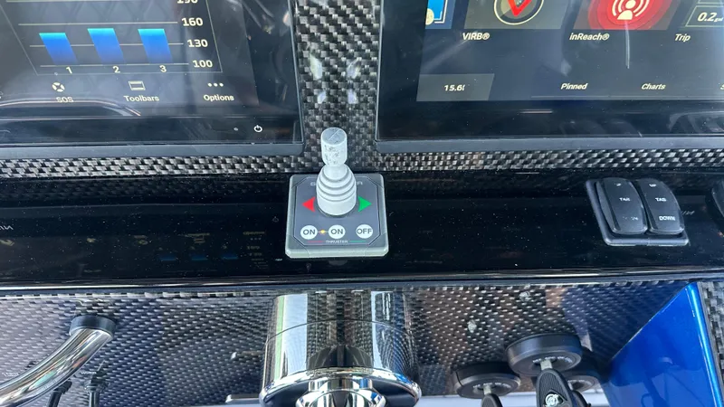 Slide: The Image of Control panel of 2020 Nor-Tech 390 Sport boat with joystick and digital displays. - 38