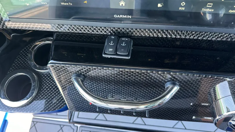 Slide: The Image of Control panel of 2020 Nor-Tech 390 Sport boat with Garmin display and carbon fiber finish. - 39