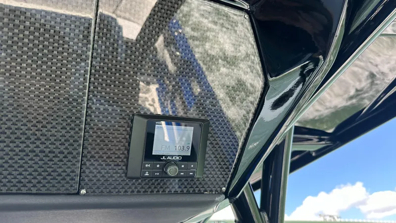 Slide: The Image of 2020 Nor-Tech 390 Sport boat with JL Audio system and carbon fiber detailing. - 42