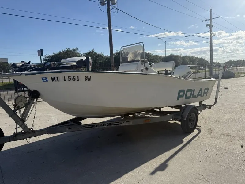 Slide: The Image of 1997 Polar 17 CC boat on trailer, parked outdoors under clear sky. - 1
