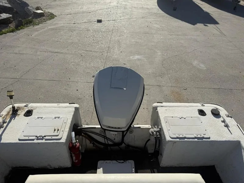 Slide: The Image of 1997 Polar 17 CC boat stern with outboard motor and storage compartments. - 11