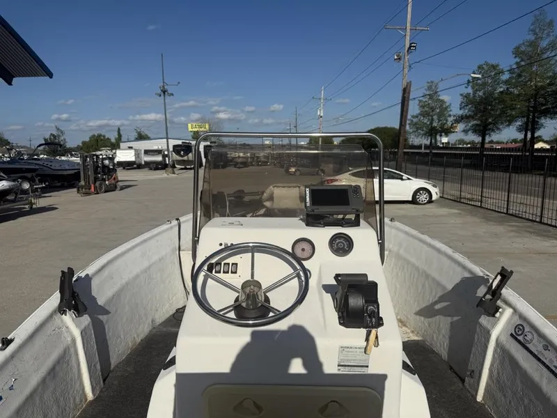 Slide: The Image of 1997 Polar 17 CC boat dashboard with steering wheel and navigation equipment. - 6