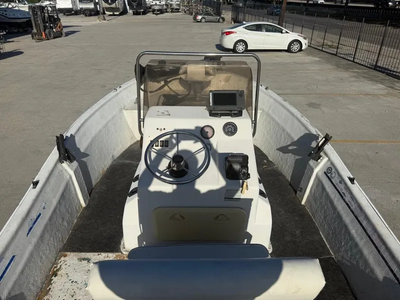 Slide: The Image of 1997 Polar 17 CC boat interior with steering wheel and control panel. - 7