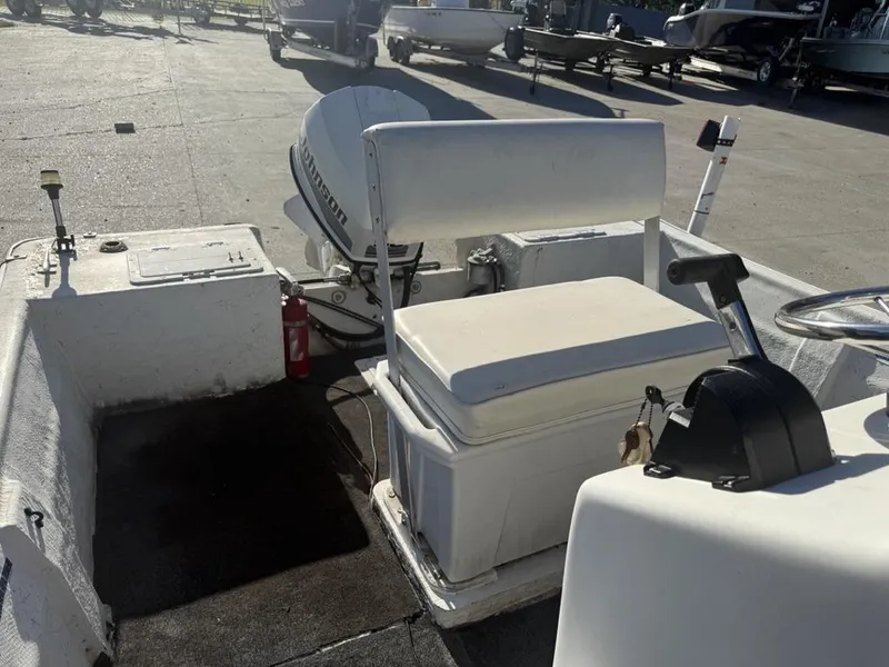 Slide: The Image of 1997 Polar 17 CC boat interior with Johnson outboard motor and steering console. - 8