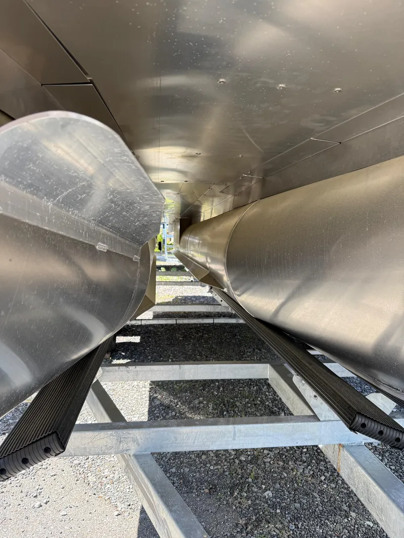 Slide: The Image of Underneath view of 2025 Sylvan L-3 CLZ pontoon boat on trailer. - 13