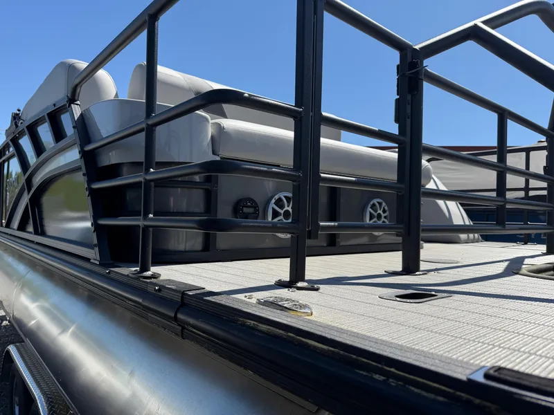 Slide: The Image of 2025 Sylvan L-3 CLZ pontoon boat with sleek railing and comfortable seating. - 5