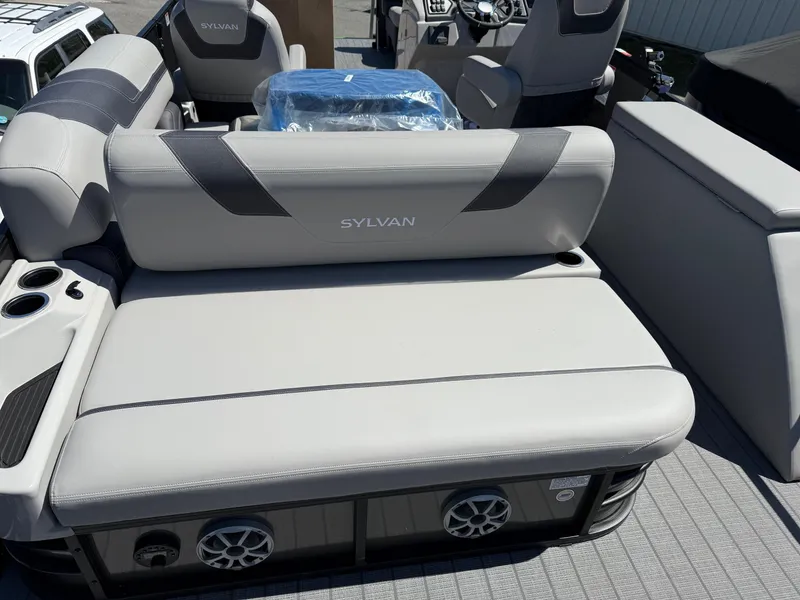 Slide: The Image of 2025 Sylvan L-3 CLZ boat interior with comfortable seating and integrated speakers. - 8