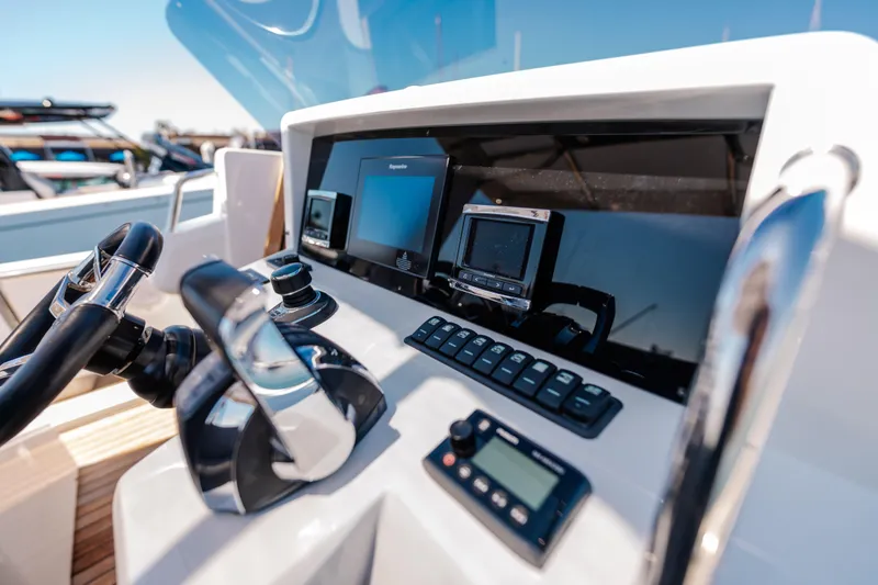 Slide: The Image of Helm of 2018 Fjord 36 Xpress with modern navigation equipment and controls. - 10