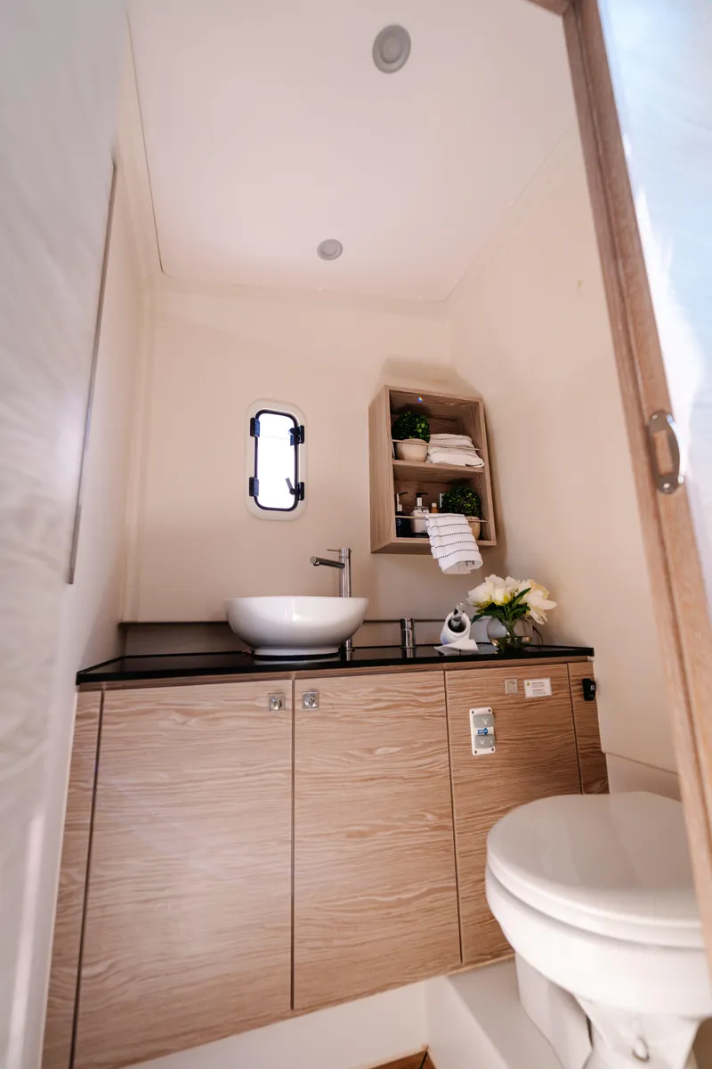 Slide: The Image of Compact bathroom in 2018 Fjord 36 Xpress yacht with modern sink and toilet. - 17