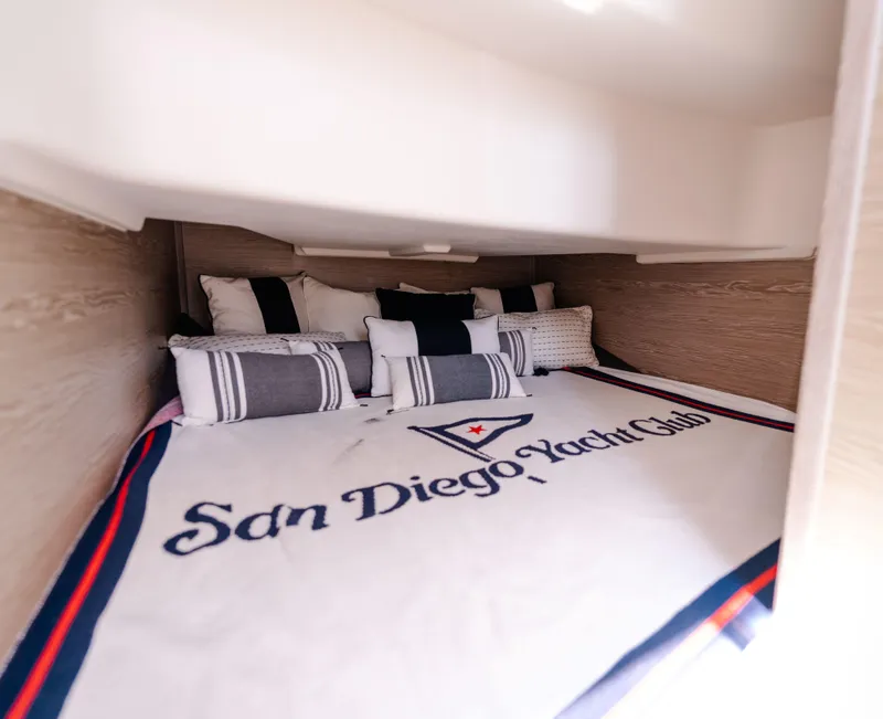 Slide: The Image of Cozy cabin interior of 2018 Fjord 36 Xpress with San Diego Yacht Club bedding. - 18