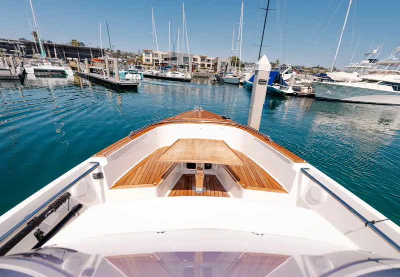 Slide: The Image of 2018 Fjord 36 Xpress boat docked in a marina with clear blue water. - 26