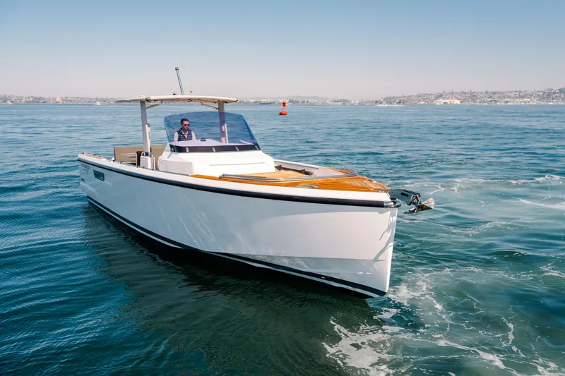 Slide: The Image of 2018 Fjord 36 Xpress boat cruising on open water under clear skies. - 28