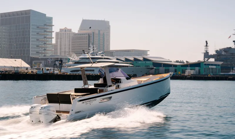 Slide: The Image of 2018 Fjord 36 Xpress cruising in urban harbor with city skyline backdrop. - 7