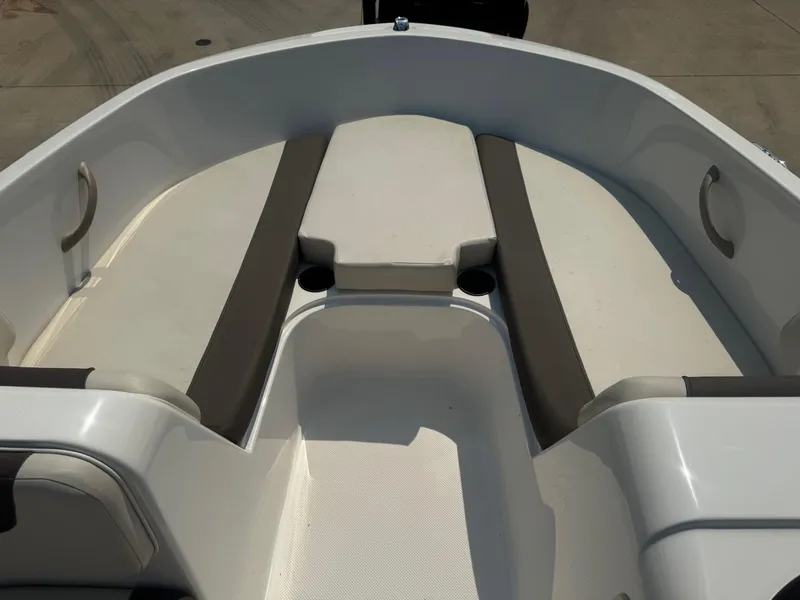 Slide: The Image of 2021 Bayliner Element E18 boat interior with seating and cup holders. - 5