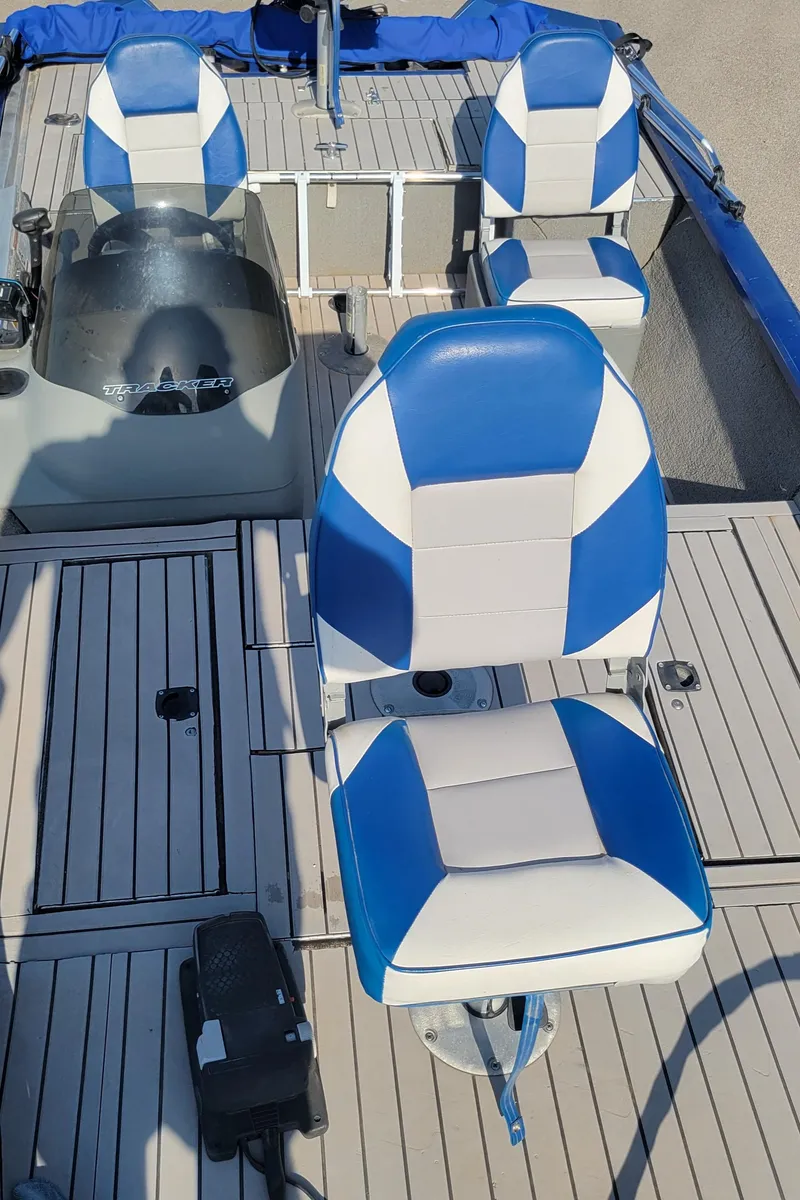 Slide: The Image of 2011 Tracker Pro Team 175TF boat interior with blue and white seating. - 3