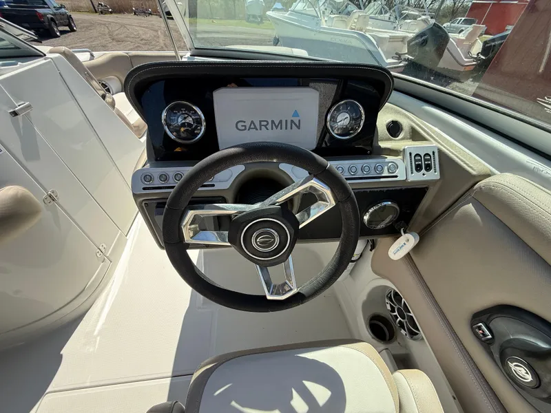 Slide: The Image of 2022 Crownline Eclipse E235 XS boat dashboard with Garmin navigation system. - 12