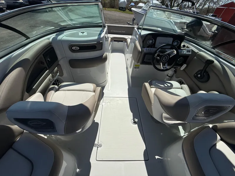 Slide: The Image of 2022 Crownline Eclipse E235 XS boat interior with modern seating and dashboard. - 15