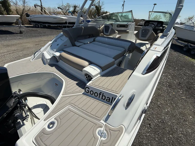 Slide: The Image of 2022 Crownline Eclipse E235 XS boat with spacious seating and modern design. - 21