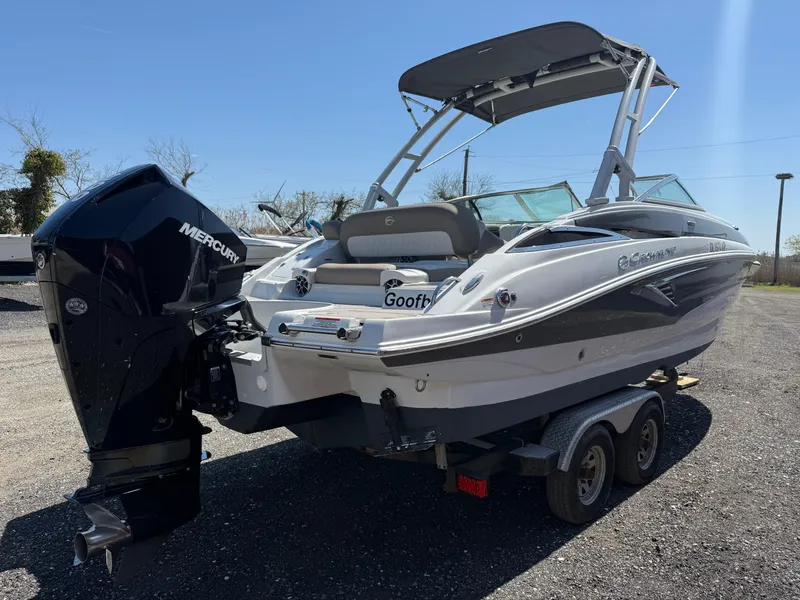 Slide: The Image of 2022 Crownline Eclipse E235 XS boat interior with seating and windshield. - 4
