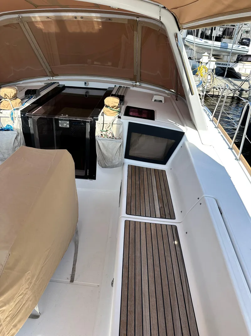 Slide: The Image of Beneteau Oceanis 41 cockpit, 2012 model, featuring teak flooring and covered seating area. - 17