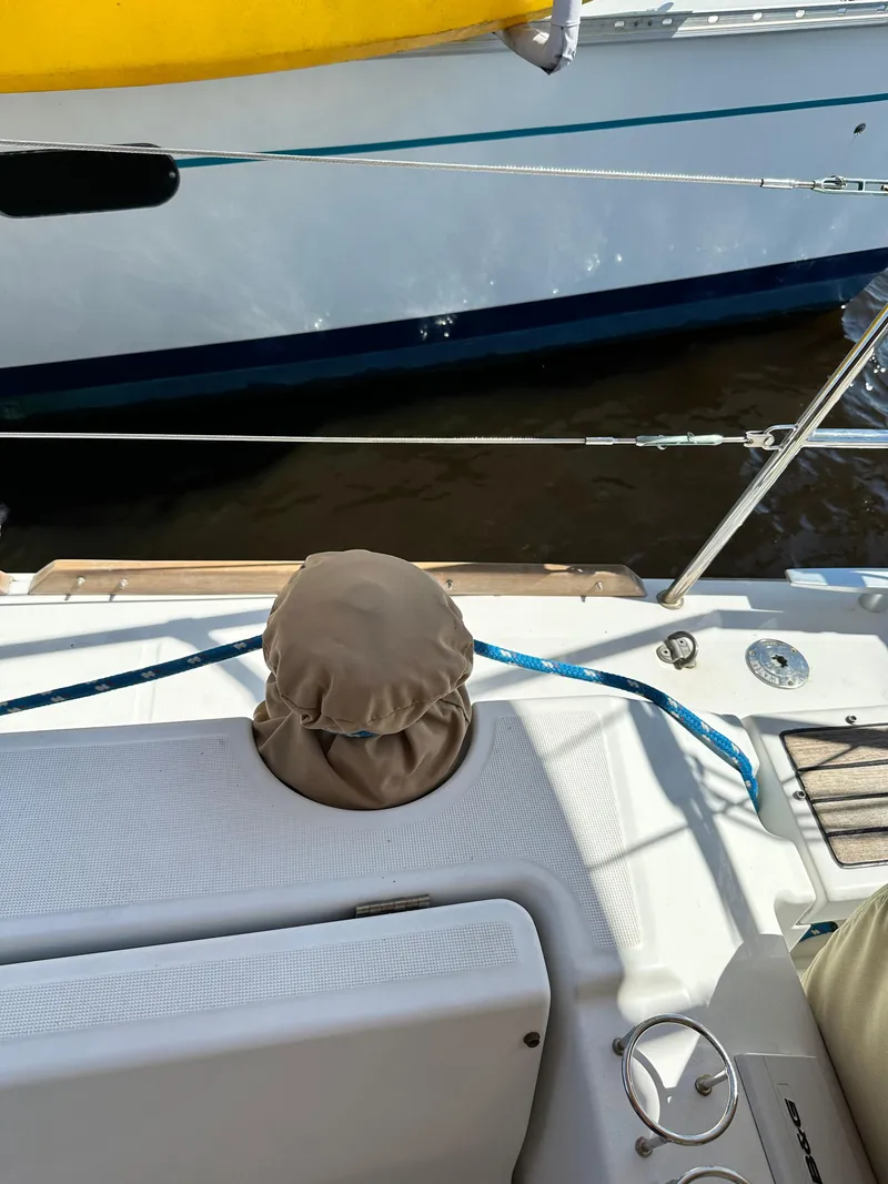 Slide: The Image of Beneteau Oceanis 41 sailboat deck, 2012 model, featuring winch cover and blue rope. - 26