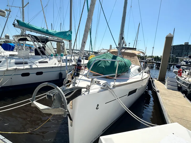 Slide: The Image of Sailboat Beneteau Oceanis 41, 2012 model, docked at marina under clear blue sky. - 3