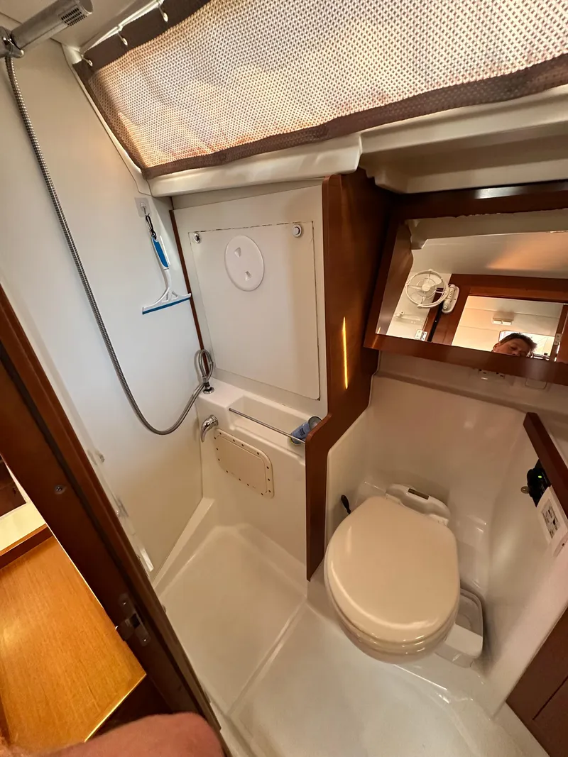 Slide: The Image of Beneteau Oceanis 41 (2012) yacht bathroom with shower, toilet, and mirror. - 46