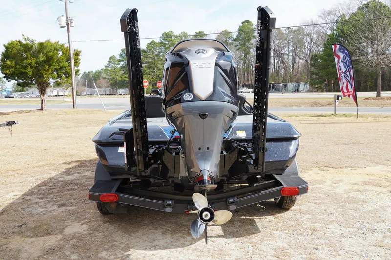 Slide: The Image of 2025 Skeeter ZXR 20 boat rear view with motor and trailer. - 4