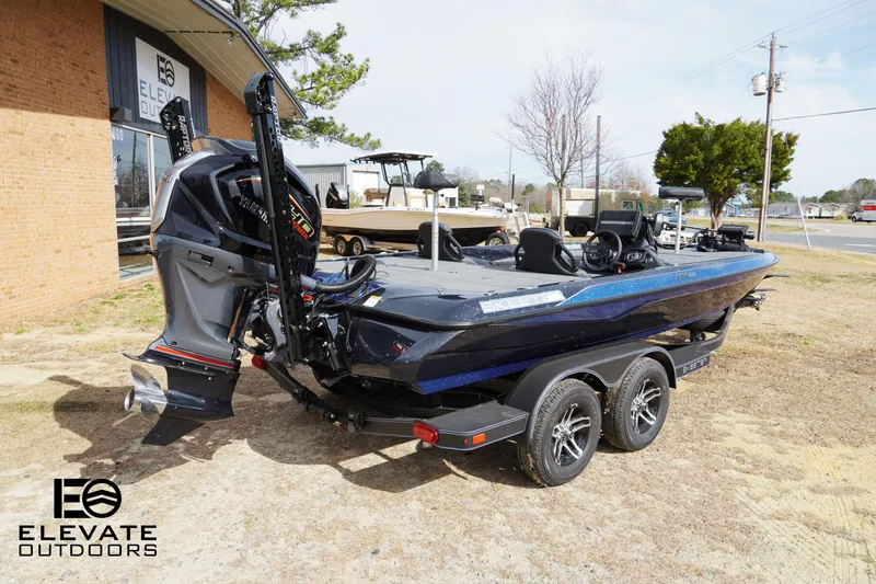 Slide: The Image of 2025 Skeeter ZXR 20 boat on trailer at Elevate Outdoors dealership. - 5