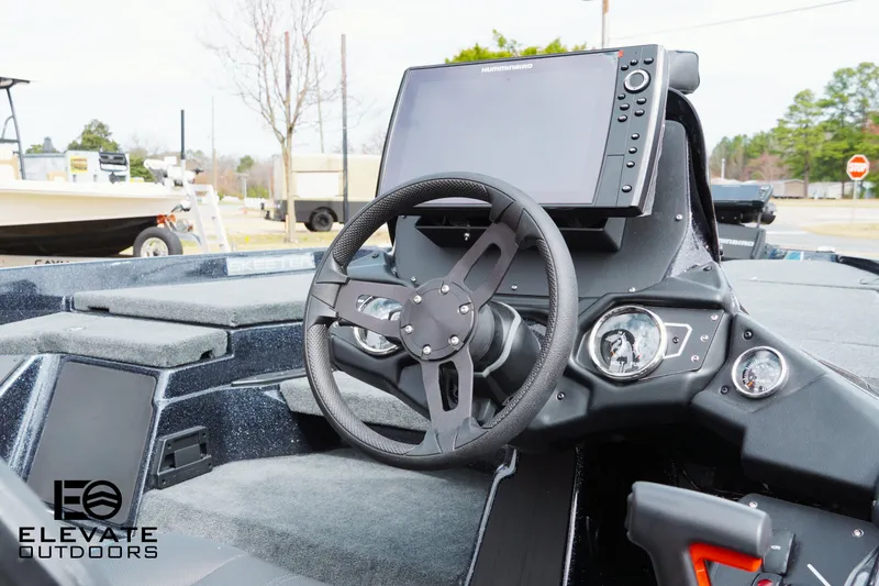 Slide: The Image of Skeeter ZXR 20 boat dashboard with steering wheel and navigation display, 2025 model. - 7