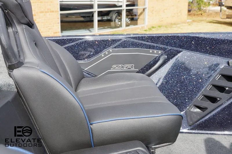 Slide: The Image of Skeeter ZXR 20 boat seat, 2025 model, with sleek black upholstery and blue accents. - 9