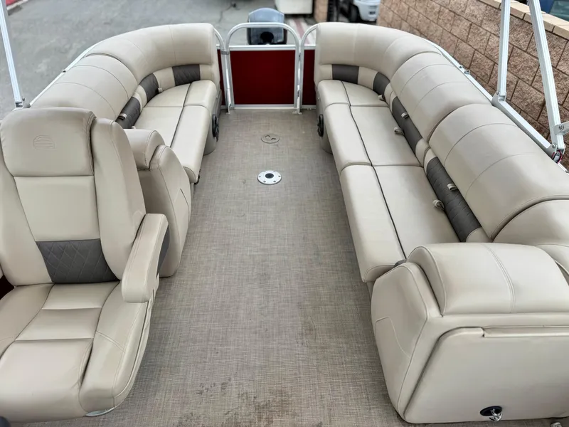 Slide: The Image of 2021 Sun Tracker Party Barge 22 DLX XP3 interior with beige seating and spacious layout. - 13