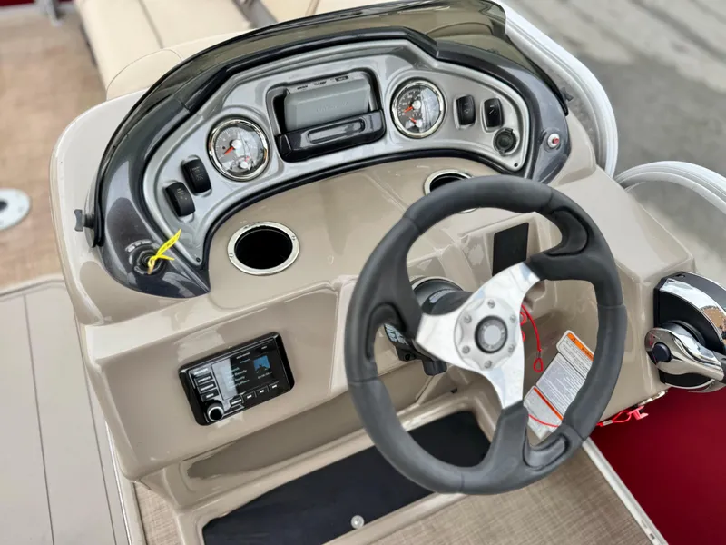 Slide: The Image of 2021 Sun Tracker Party Barge 22 DLX XP3 dashboard with steering wheel and controls. - 19