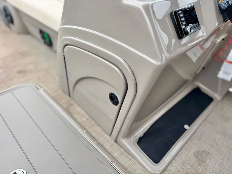 Slide: The Image of Control panel and storage area of 2021 Sun Tracker Party Barge 22 DLX XP3. - 21