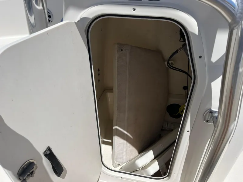 Slide: The Image of Storage compartment of 2020 Bulls Bay 230 Center Console boat, open with visible interior. - 15