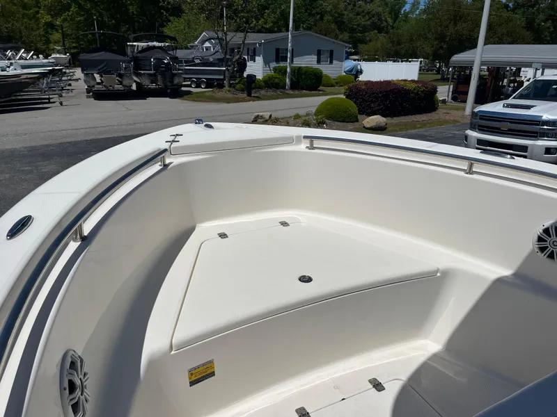 Slide: The Image of 2020 Bulls Bay 230 Center Console boat, spacious deck, parked outdoors. - 16